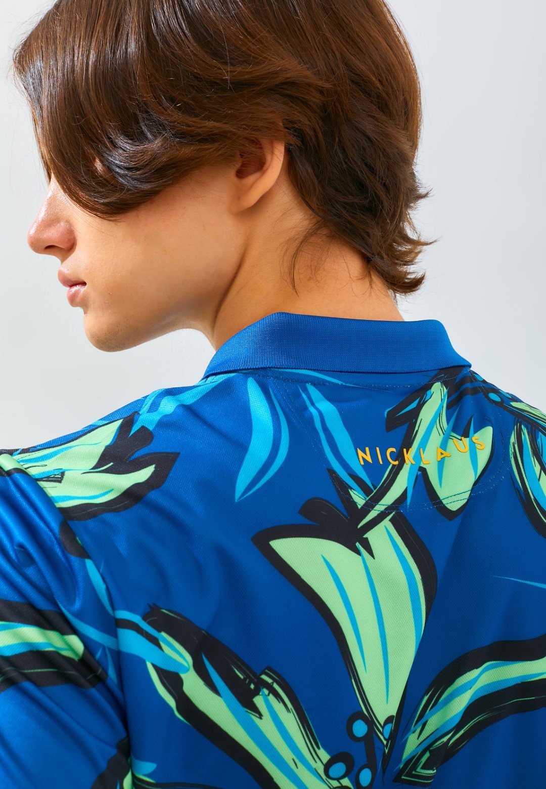 Jack Nicklaus Hibiscus Polo Shirt Pria Slim Fit Ocean Blue - Image 6